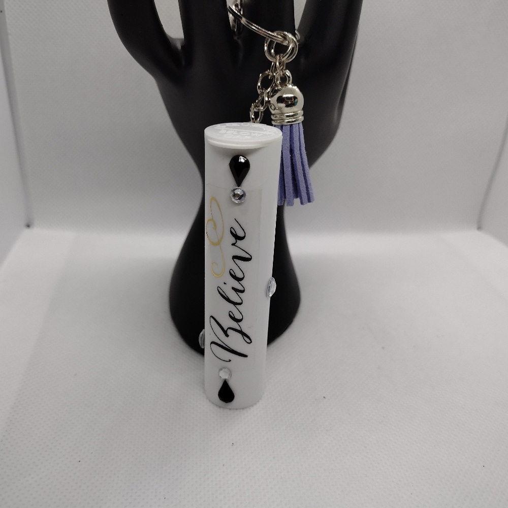 White Believe Stash Keeper Keychain with Purple Tassel